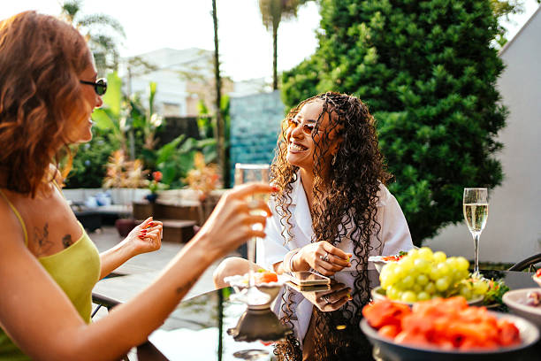 istock Two friends enjoying a sunny afternoon at a pool party. 2253400933