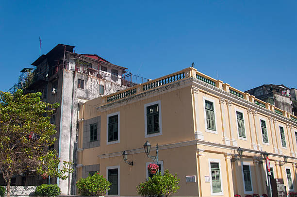 A yellow building in the unesco world heritage site, saint dominics square, in Macau China on a sunny day.