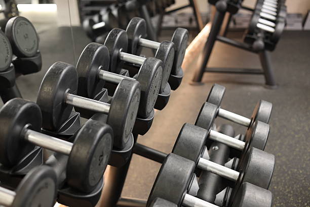 istock Modern gym interior with weightlifting equipment 2253403724