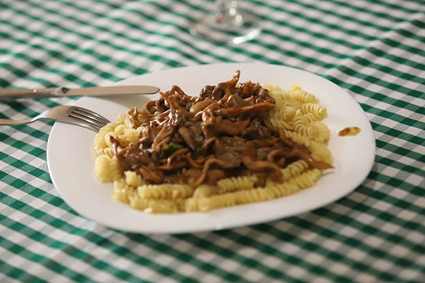 Pasta dish with shimeji mushrooms and grated cheese