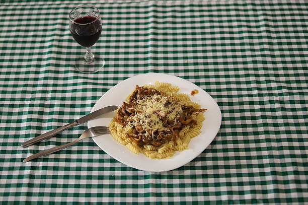 Pasta dish with shimeji mushrooms and grated cheese