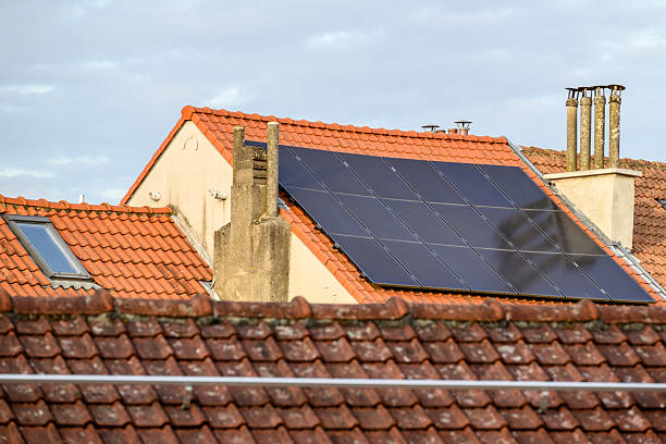 istock Rooftop solar panels on a residential building 2253405470