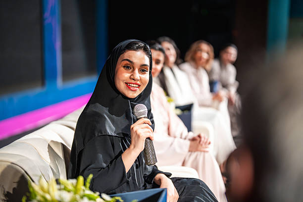istock Enthusiastic Middle Eastern Woman Addressing Panel in Riyadh Auditorium 2253406342