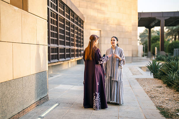 istock Arab Female Students Engaging in Lively Academic Interaction Outdoors 2253406665