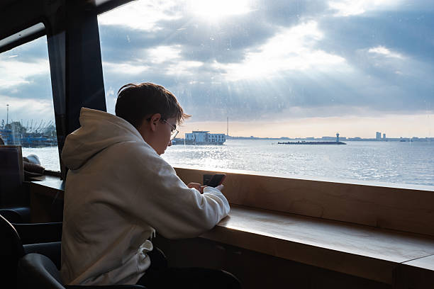 Harbor Ferry in Front of Hamburg Skyline – Iconic Water Transport with Historic Port, Cranes, and Cityscape in Scenic Light
