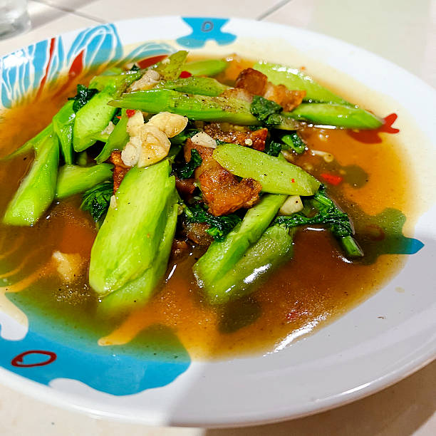 Fried hai egetanles and pork belly in oyster dauce