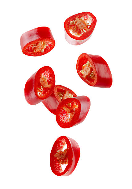 istock Red hot sliced chili pepper forming  figure looks like a loop in space. Volumetric light from behind. Isolated on white. 2253410717