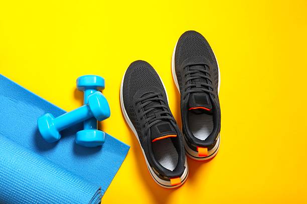 istock Sport equipment on color background, top view 2253411178