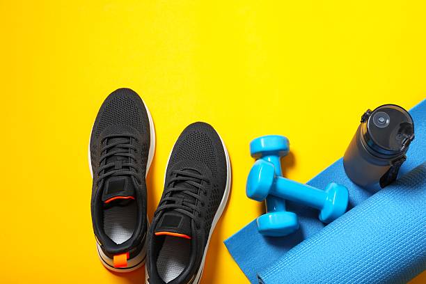 istock Sport equipment on color background, top view 2253411188