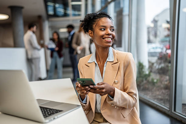 istock Professional woman using phone in office 2253411206