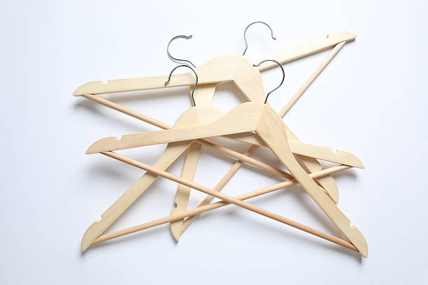Many coat hangers hanging on a clothes rail