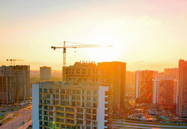 istock Construction site at sunset showcasing urban development in growing city. 2253413993