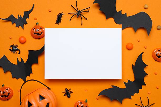 istock Halloween holiday decorations including pumpkins, spiders, bats on orange background 2253414678