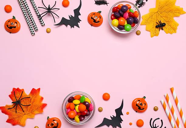 istock Halloween holiday decorations including pumpkins, spiders, bats on color background 2253414995