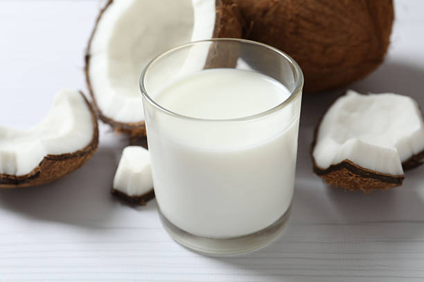 istock Glass of milk with coconuts on the table 2253415229
