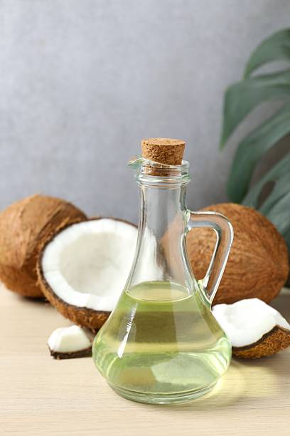 istock Bottle of coconut oil on the table 2253415341