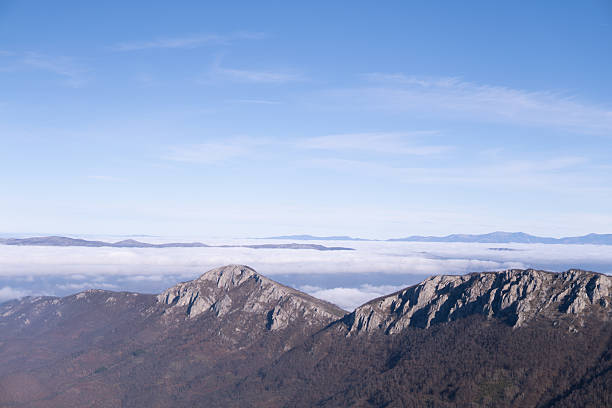 istock Mountain ridge above the clouds with mountain range in the back 2253427965