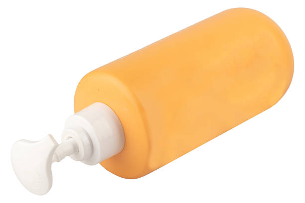 istock plastic spray bottle isolated on white background color orange 2253430464