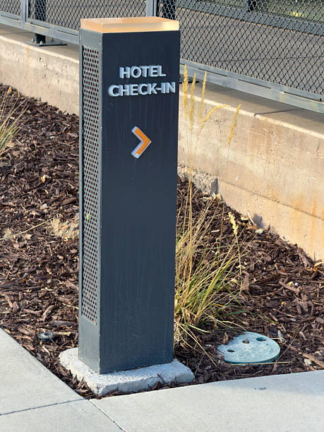 istock Modern hotel check-in sign with an arrow pointing right 2253435061
