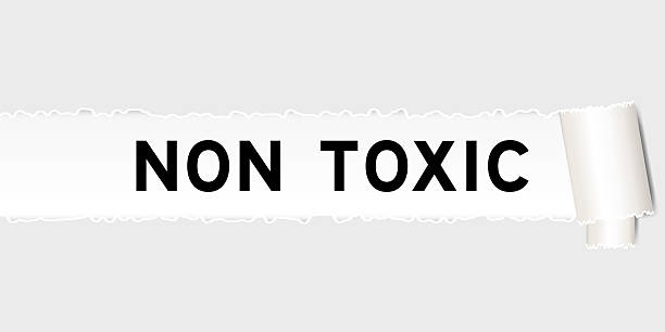 istock Ripped gray paper background that have word non toxic under torn part 2253437934