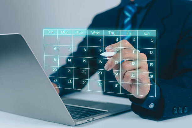 istock Business people use work schedules in business as a technological plan and project for proper planning and knowing the timeline of the work progress. 2253438779