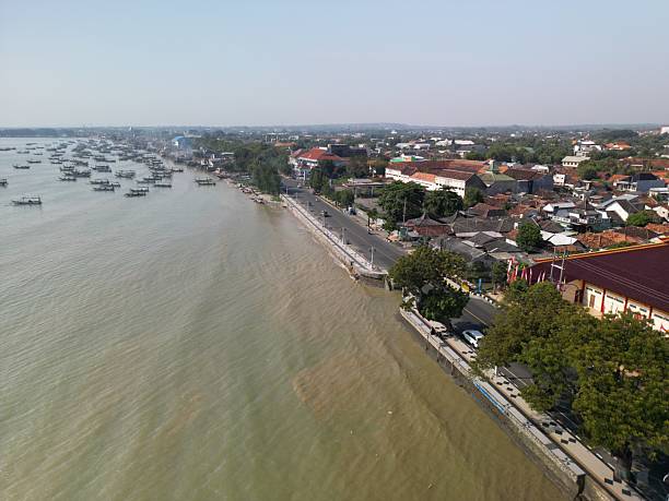 Tuban, East Java, Indonesia - July 11, 2025: Coast line at downtown Tuban, in front of Kwan Sing Bio temple