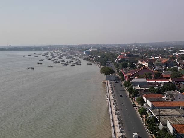 Tuban, East Java, Indonesia - July 11, 2025: Coast line at downtown Tuban, in front of Kwan Sing Bio temple