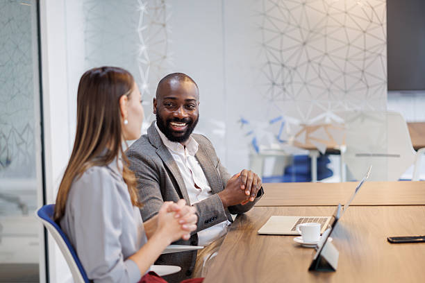 istock Diverse business professionals discussing work during a modern office meeting, fostering collaboration and teamwork 2253440436
