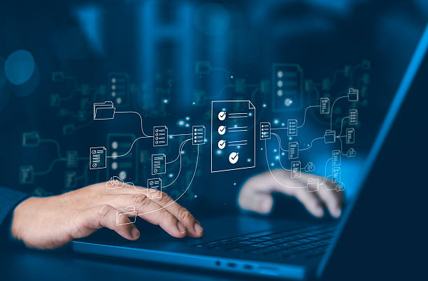 istock Businessman using laptop for digital document management system with virtual files and folders. Concept of cloud computing, online database, data storage, paperless office, and smart technology. 2253440961