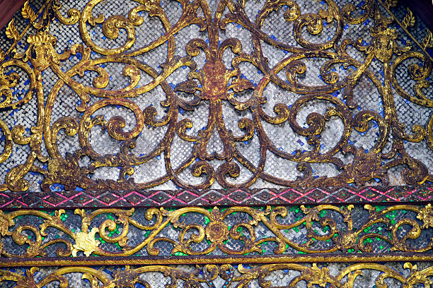 Beautiful ornate metalwork featuring intricate golden patterns and colorful accents creates a stunning visual impact, showcasing exquisite craftsmanship and artistic design.