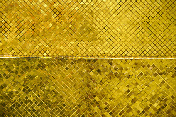 This captivating golden mosaic pattern features shiny square tiles arranged in an elegant design. The vibrant texture enhances any interior space with a touch of luxury.