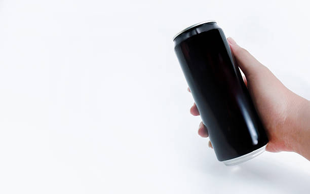 istock Mock up, Hand Holding Blank Black Aluminum Beverage Can Isolated on White, studios shot with copy space 2253446252