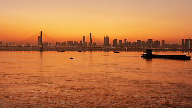 istock Twilight background of sunset over the modern urban waterfront skyline 2253447902