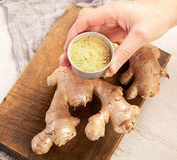 istock Fresh ginger with sliced and green leaves. 2253449563