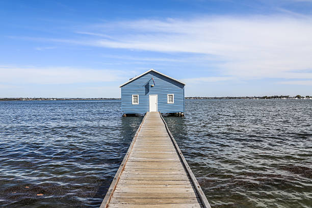 A beautiful blue dock and boardwalk in the city bay, perfect for taking photos.