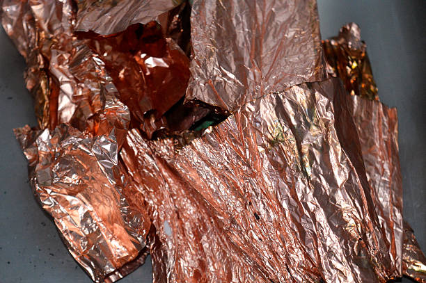 copper leaf flakes, tiny, thin pieces of genuine copper or copper alloy (like brass) hammered into fine sheets and then broken or cut into flakes, used for arts and crafts