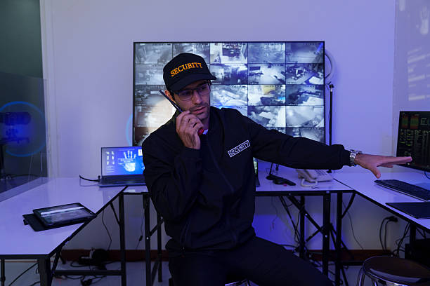 istock Security officers are checking the TV screen of the CCTV system. ( PHOTO ) 2253450457
