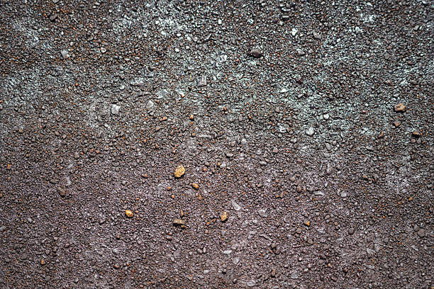 Dirt, terrain or gravel stone road surface pattern in outdoor environmental. Background and textured photo.