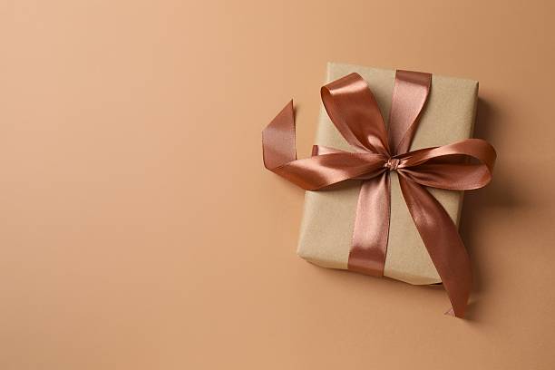 istock Beautiful gift box on color background, top view 2253454115