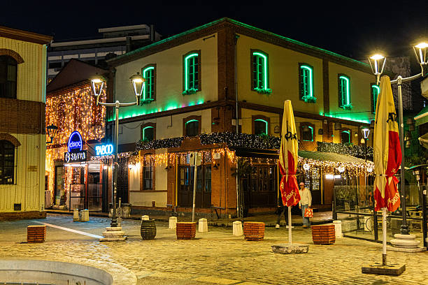 Greece, Drama - December 25, 2018: Night view of the greek Christmas market “Oneiroupoli” with lights, figurines around the river in Drama, Greece