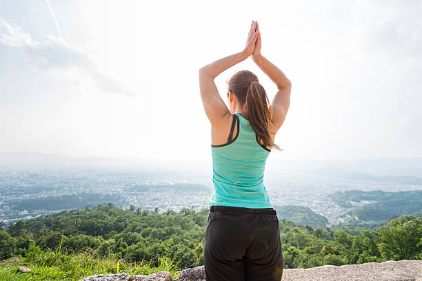 asian woman doing stretching in the nature