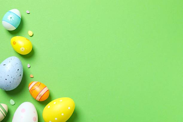 istock Happy Easter. Colorful eggs on color background, space for text or advertising 2253459173