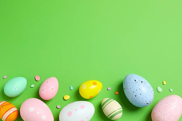 istock Happy Easter. Colorful eggs on color background, space for text or advertising 2253459189