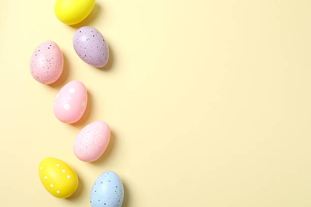 istock Happy Easter. Colorful eggs on color background, space for text or advertising 2253459799