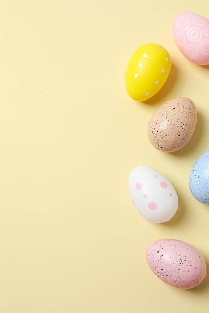 istock Happy Easter. Colorful eggs on color background, space for text or advertising 2253459818