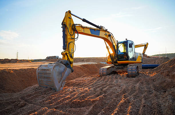 istock Excavator earthworks on construction site.  Sewer Line Repair. 2253460158