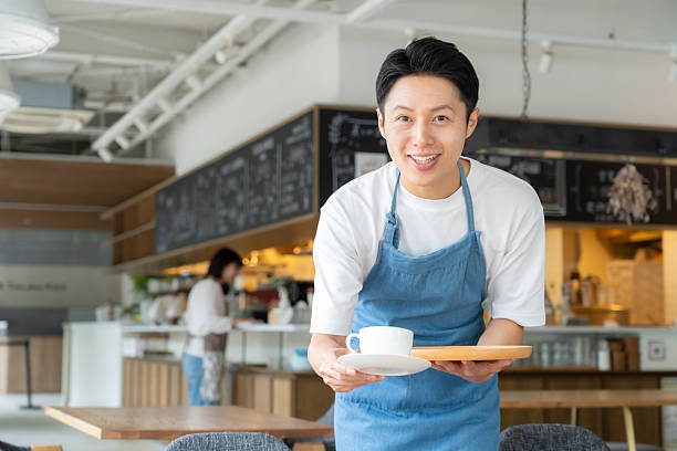 istock Male clerk working at a cafe 2253460670