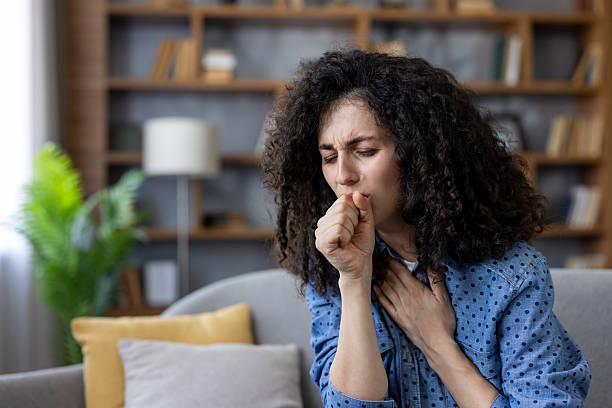istock Woman coughing feeling sick from cold flu virus at home 2253462798