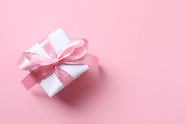 istock Beautiful gift box on pink background 2253462824