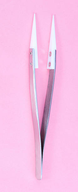 Steel Ceramic Tweezer  on pink background